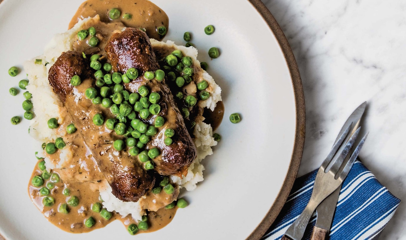 Meaty Vegan Bangers and Mash With Herbed Gravy