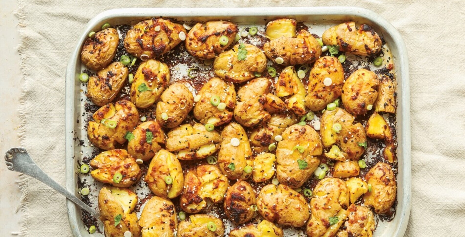 Garlicky Miso-Butter Sheet Pan Smashed Potatoes